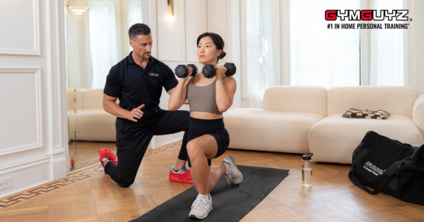 GYMGUYZ in-home personal training franchise awarded Virginia territory with trainer coaching client during workout