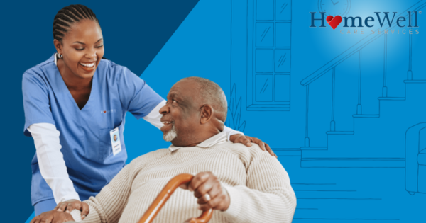 HomeWell senior care franchise caregiver assisting elderly man at home in Laguna Beach CA in-home care services